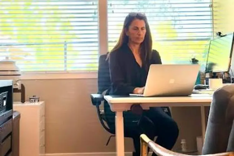 Dr. Samia McCully, ND working at her desk in the Wellness Architecture clinic