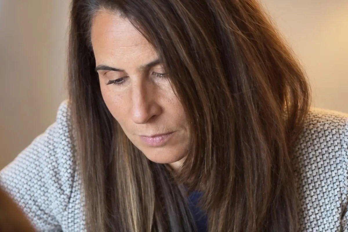 Dr. Samia McCully, ND reading a patient's results