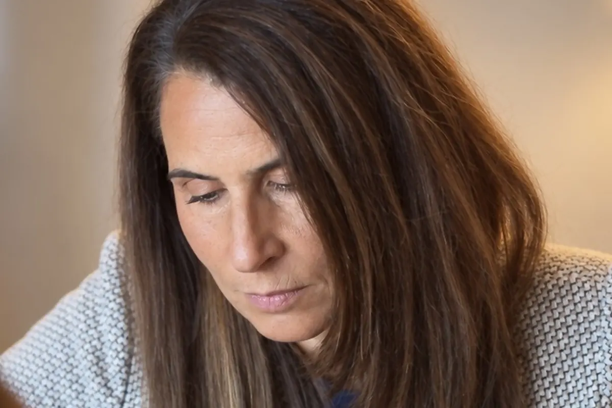 Dr. Samia McCully, ND studying a patient's lab report